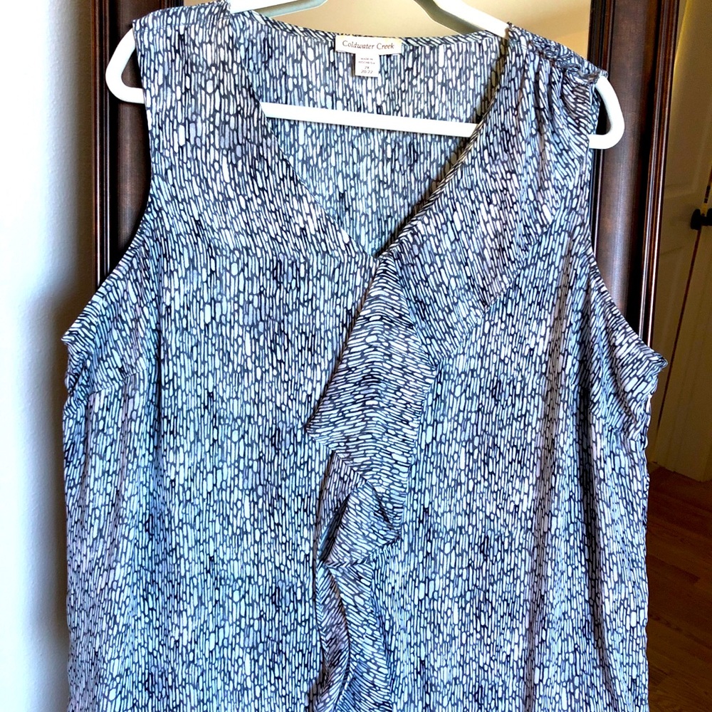 Sleeveless blouse with ruffle front detail